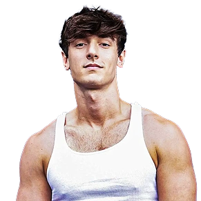 A young man with messy dark hair, wearing a white tank top, looking at the camera.