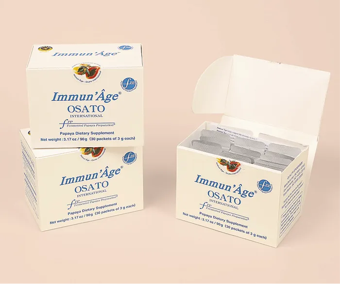 Three boxes of Immun'Âge Papaya Dietary Supplement, with one box open revealing individual foil packets.