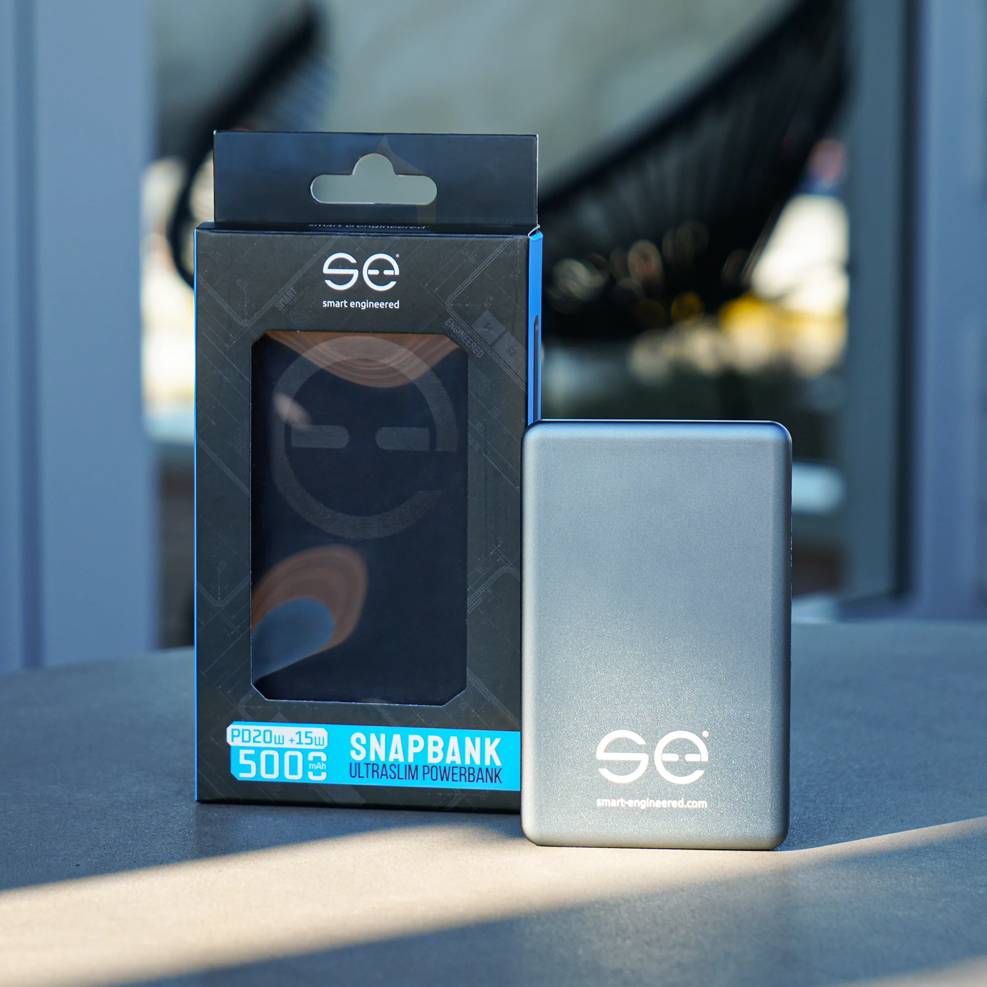 A power bank and its packaging on a table.