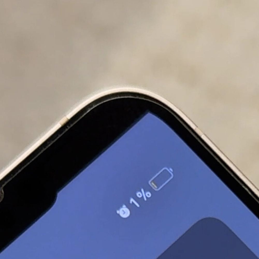 Close-up of a smartphone screen showing 1% battery remaining.