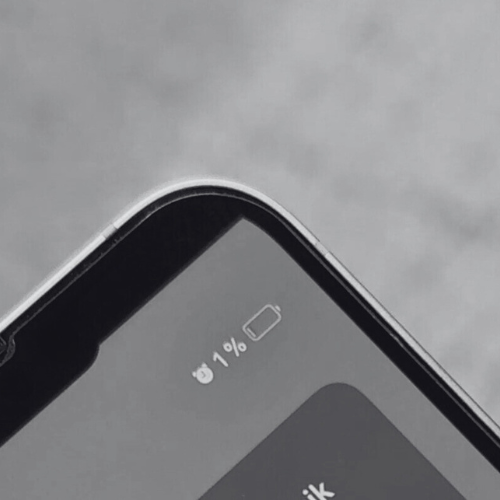 Close-up of a smartphone screen showing 1% battery remaining.