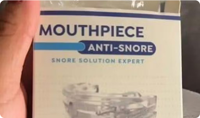 Box for an anti-snore mouthpiece labeled 'Snore Solution Expert.'