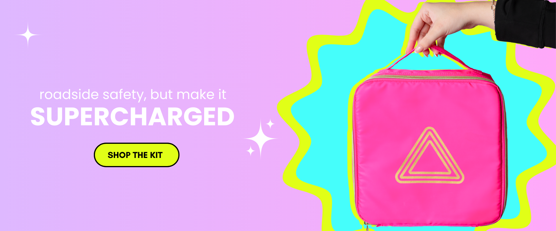 Hand holding a pink safety kit bag with a triangle symbol.