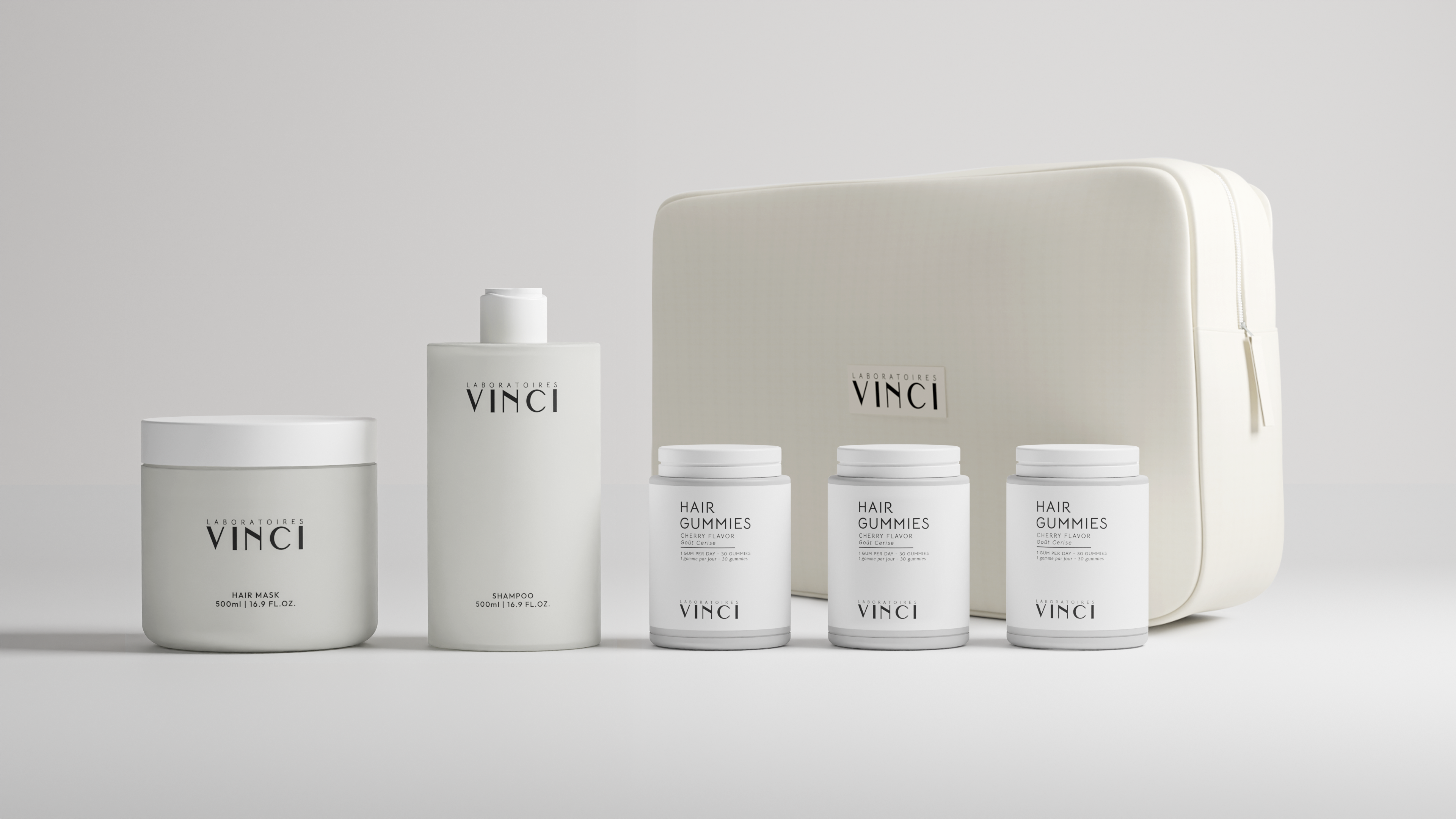 White bottles and containers of hair products with a beige bag.