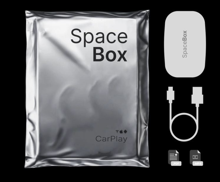 A shiny silver package labeled 'Space Box' with accompanying device and cable.