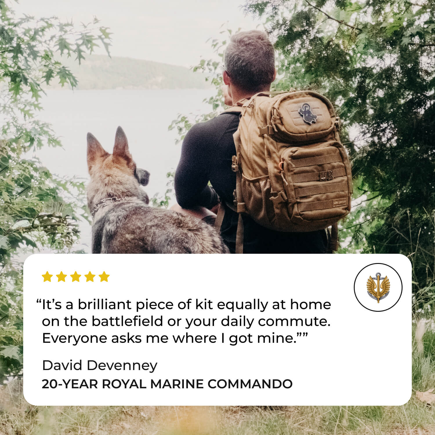 Man with backpack and dog sitting in nature, overlooking water.