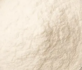 A close-up, top-down view of a fine, off-white powder.