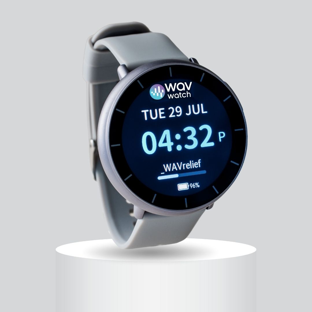 A smartwatch with time and date display, shown on a pedestal.