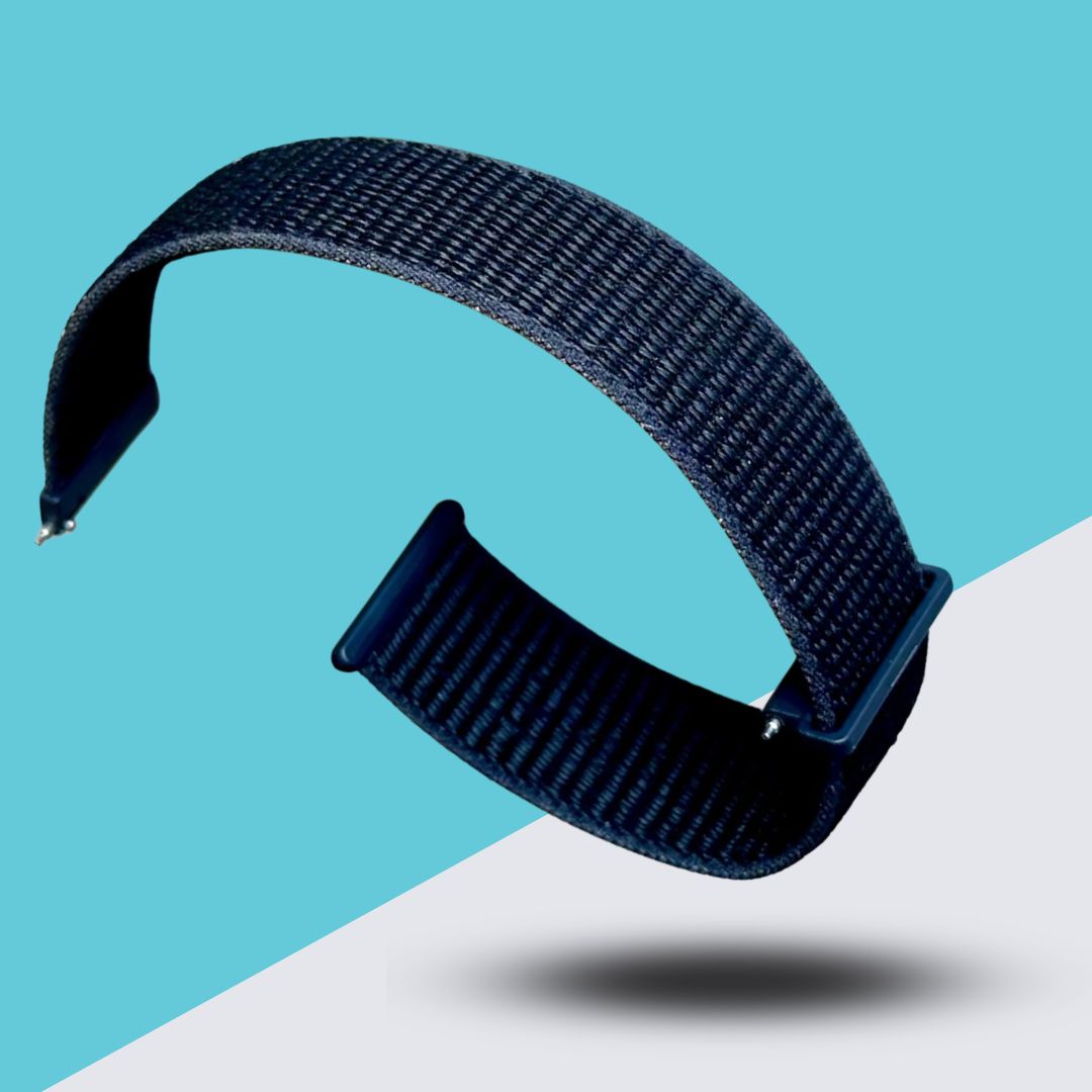 A dark blue woven fabric watch strap floating over a blue and white background.