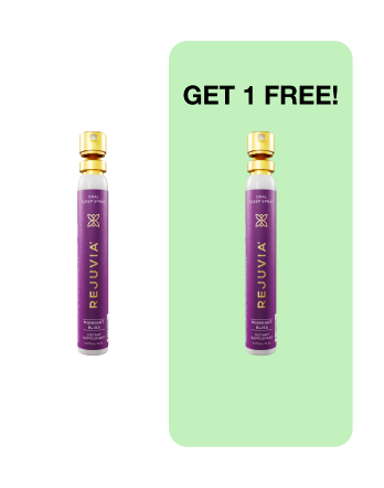 Two purple spray bottles with 'REJUVIA' label; text 'GET 1 FREE!' on green background.