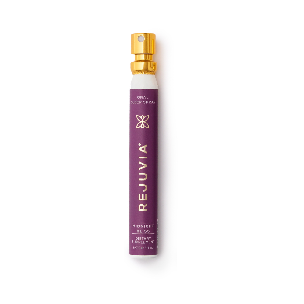 Purple and gold oral sleep spray labeled 'Rejuvia Midnight Bliss' on a white background.