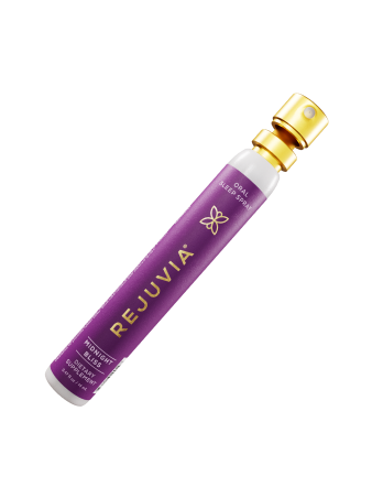 Purple spray bottle labeled 'REJUVIA' with a gold cap.