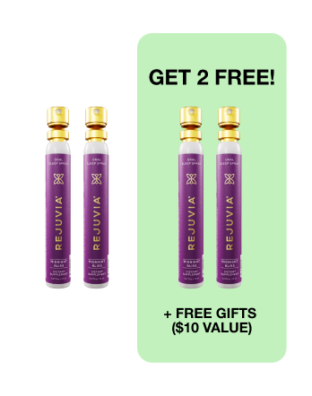 Four purple spray bottles with gold caps and promotional text for free gifts.