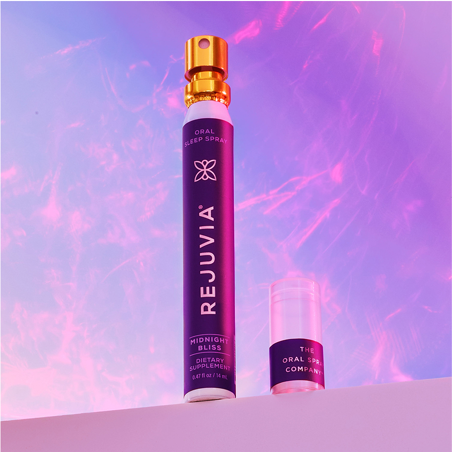 Rejuvia oral sleep spray against a purple sky background.