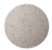 Circular speckled pill with a textured surface.