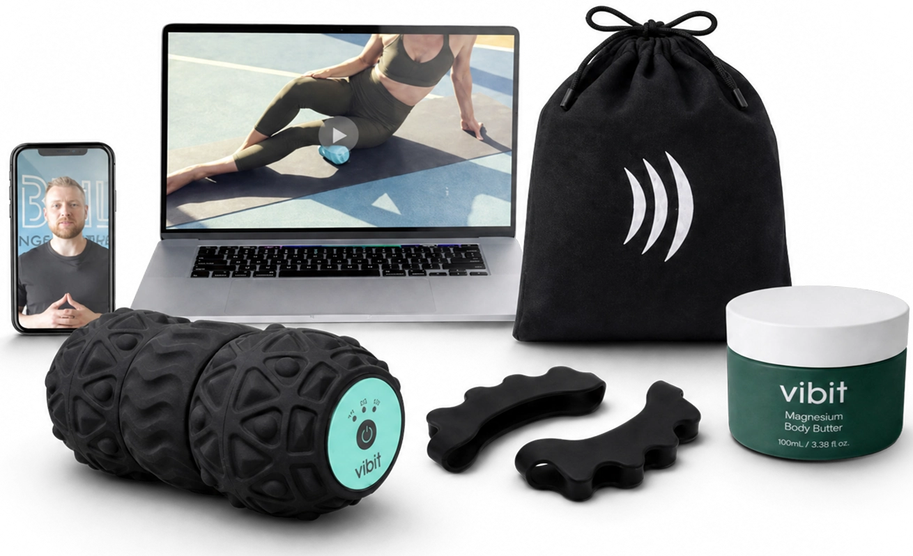 A collection of fitness recovery products including a foam roller, body butter, and a laptop with videos.