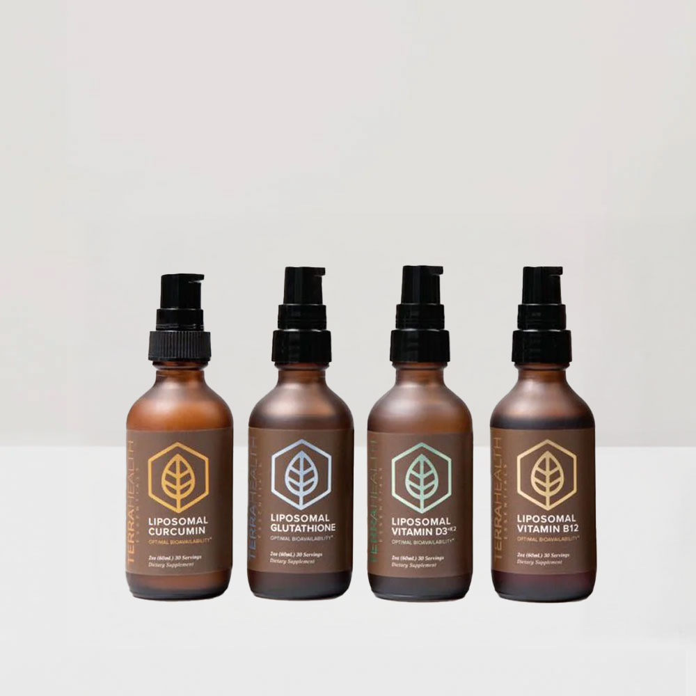 Four bottles of liposomal supplements with pump dispensers on a neutral background.