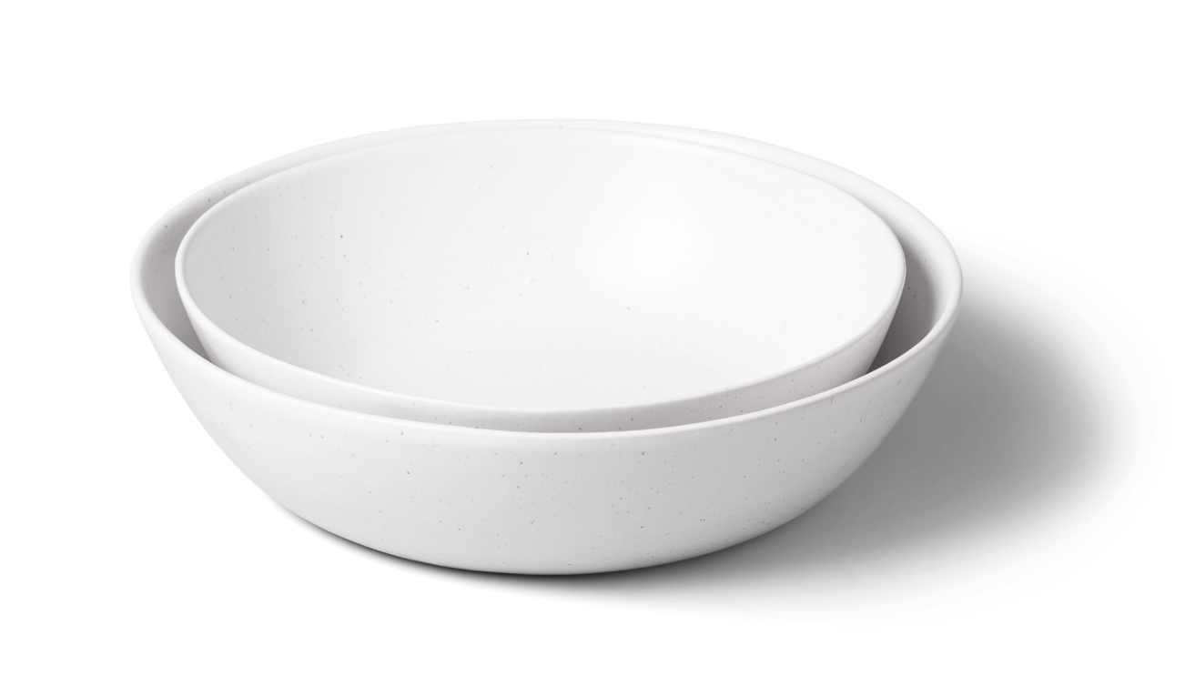Two white ceramic bowls stacked together.