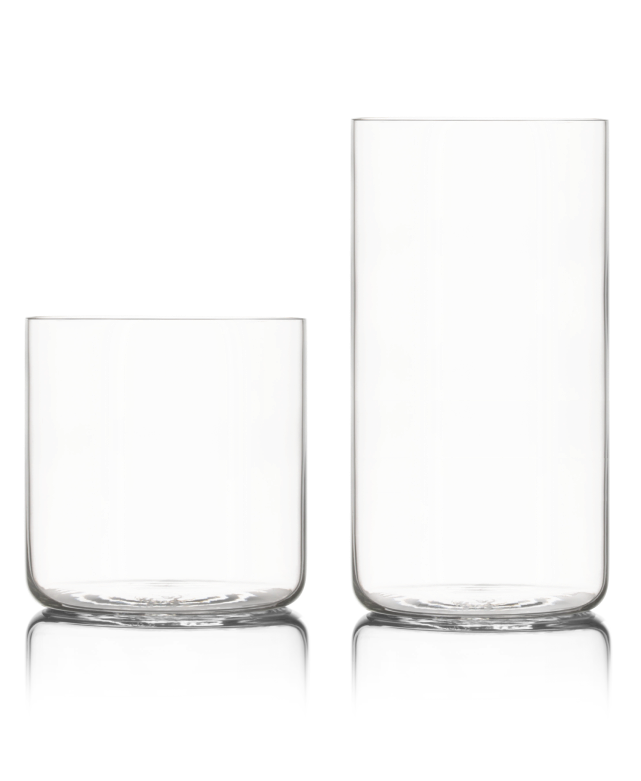 Two clear glass cups, one short and one tall, against a white background.