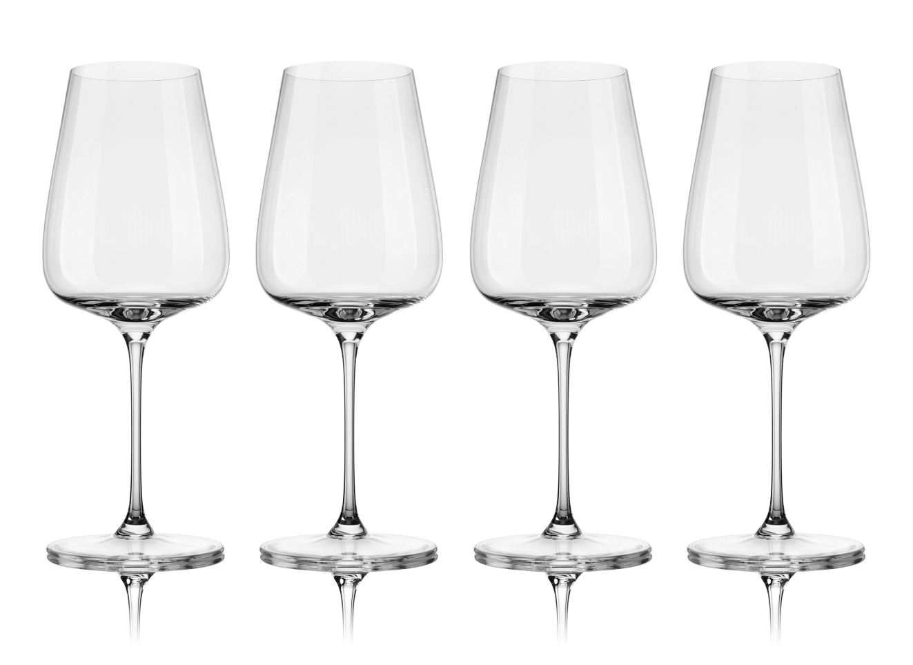 Four empty wine glasses with long stems on a black background.