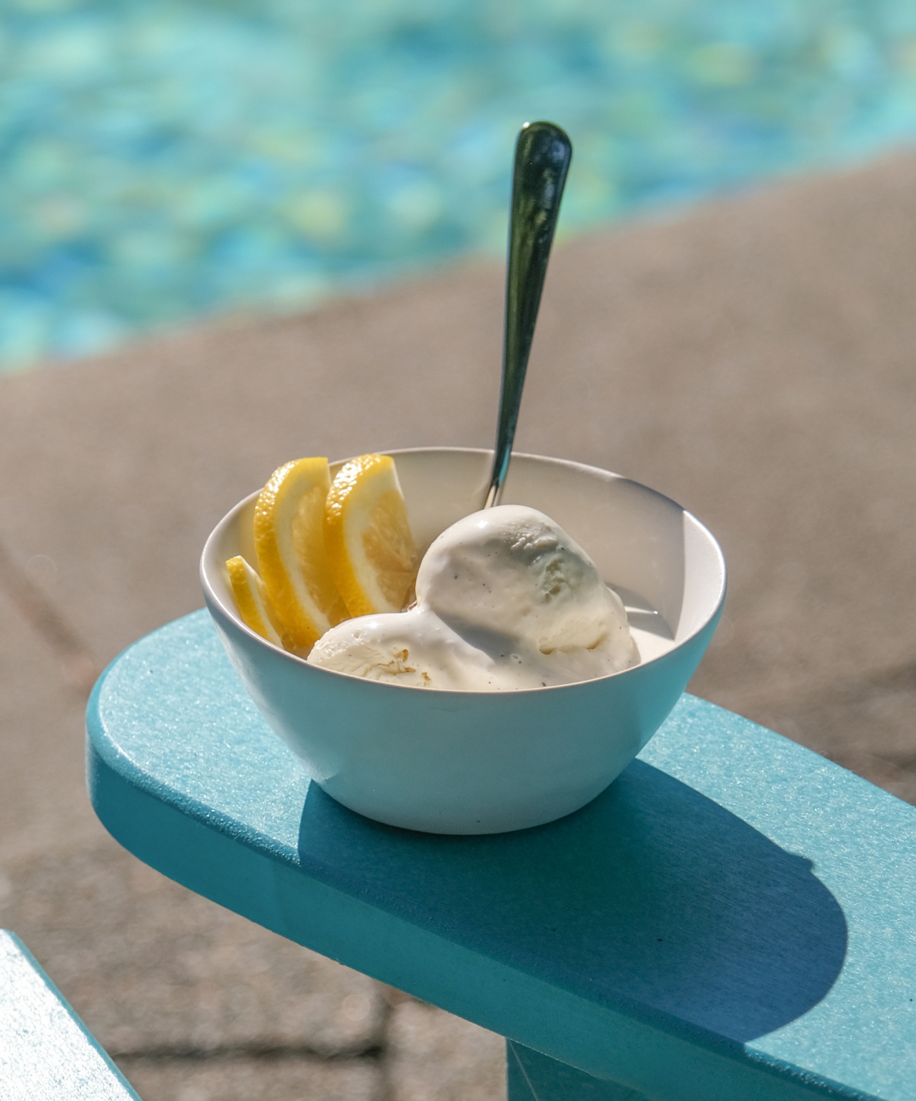 Ice cream with sliced lemon is served by the pool