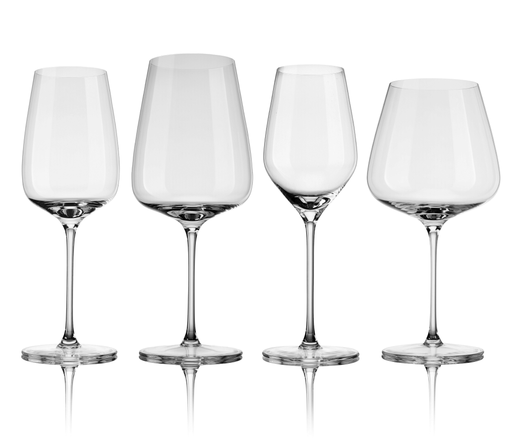 Four different wine glasses on a white background.