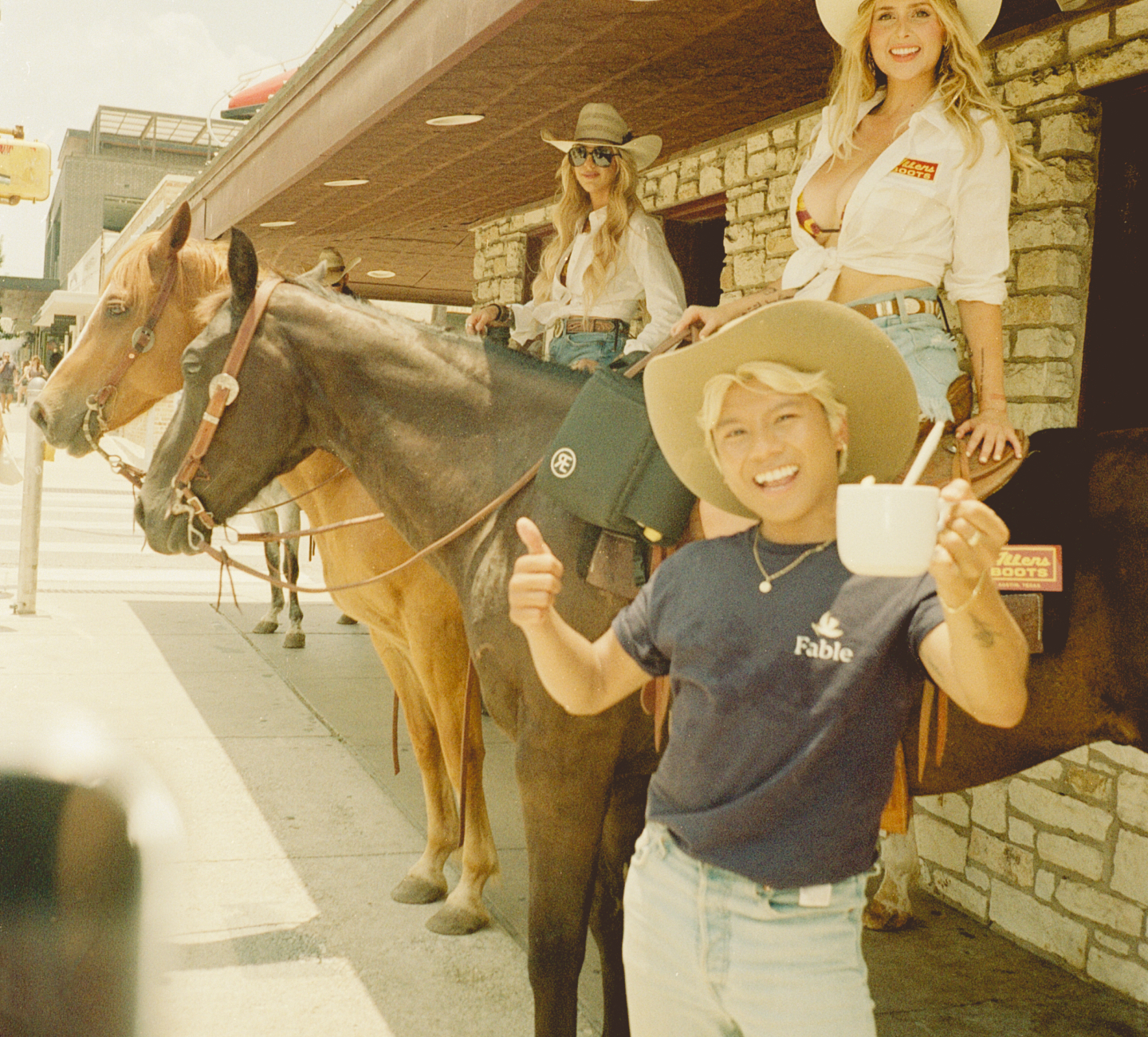 A man in austin in front of horses