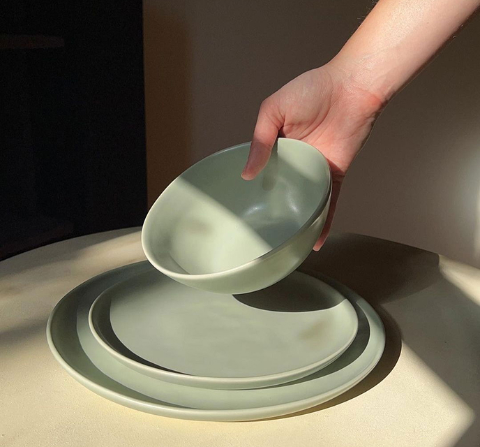 Fable beachgrass  green dinnerware set on a table