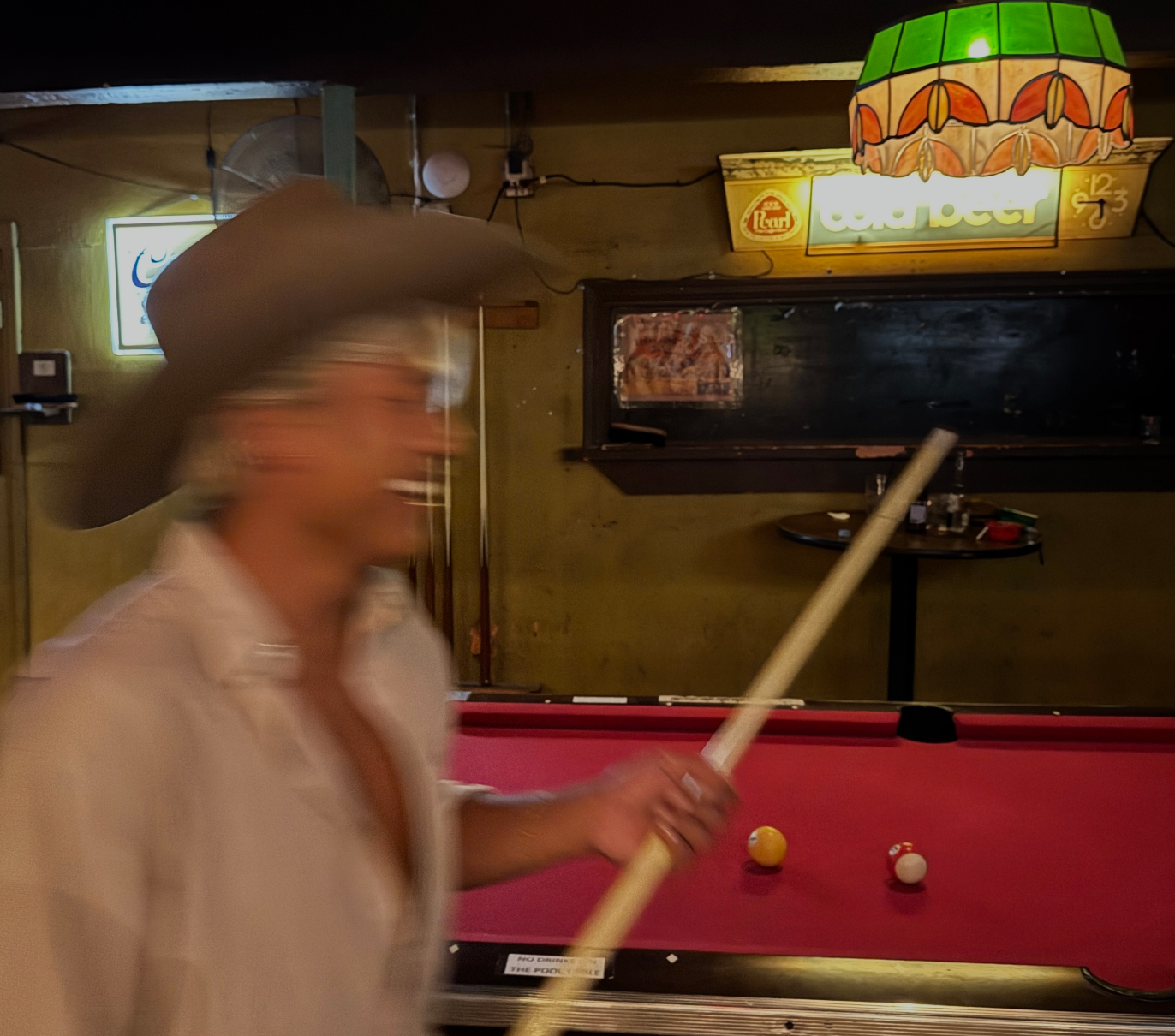 A Fable employee plays pool