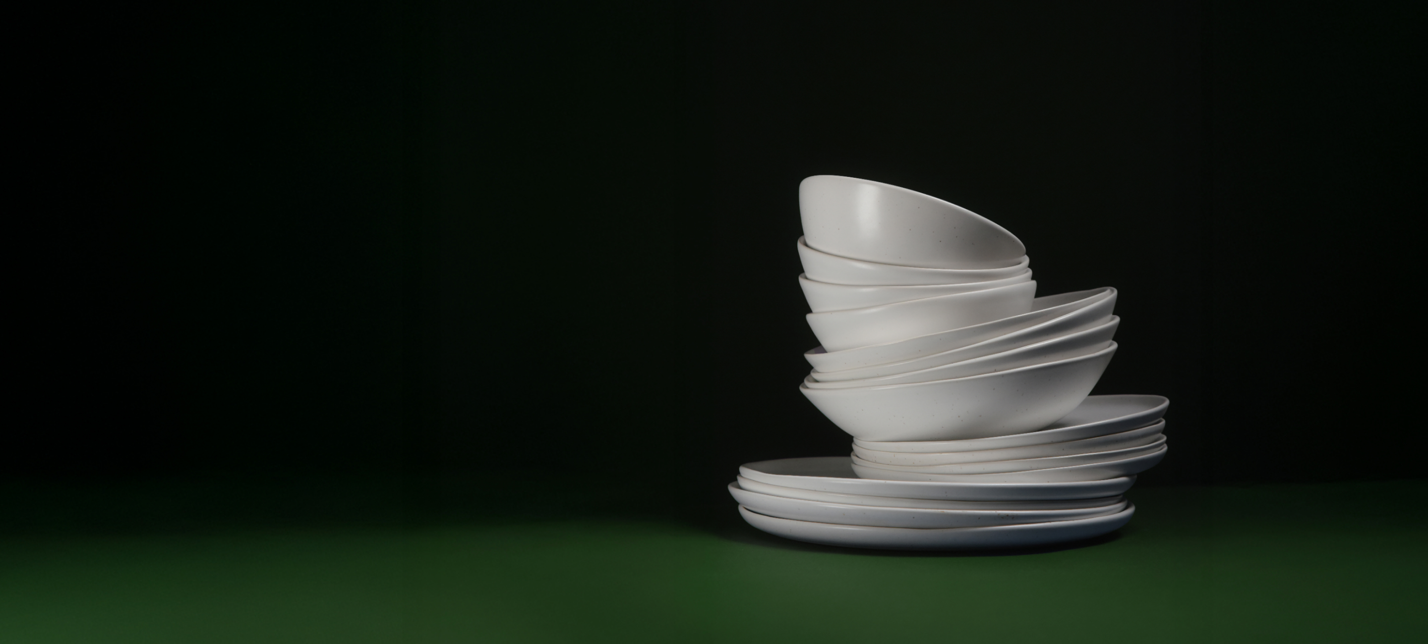 White dinnerware set on the black background