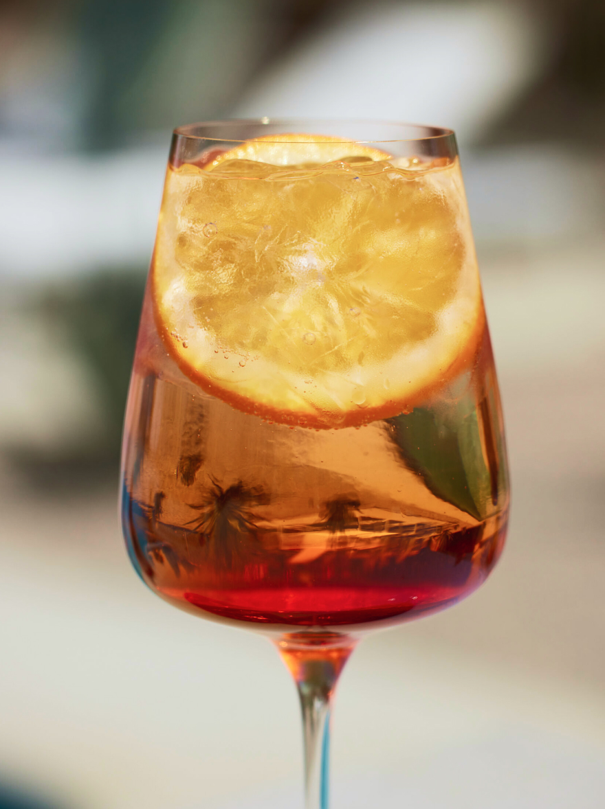 A wine glass with a cocktail