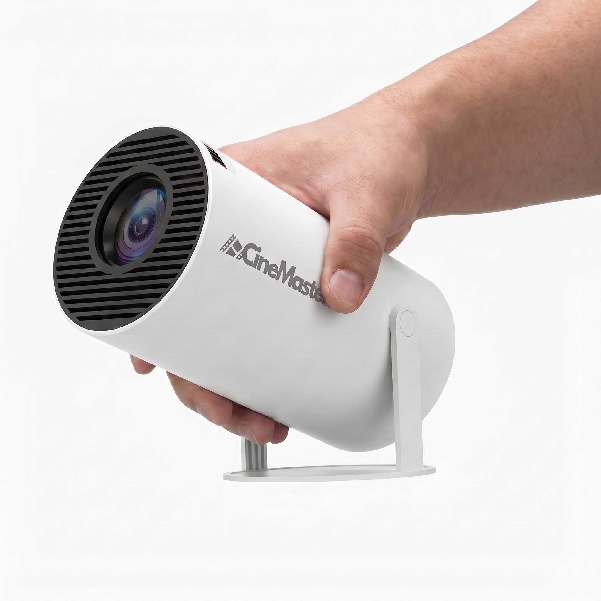 A hand holds a small, white, cylindrical CineMaster projector on a stand against a white background.