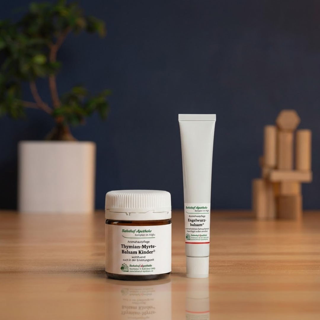 Boxes of Femibion and Folio nausema pregnancy supplements stacked on a wooden counter in a pharmacy.