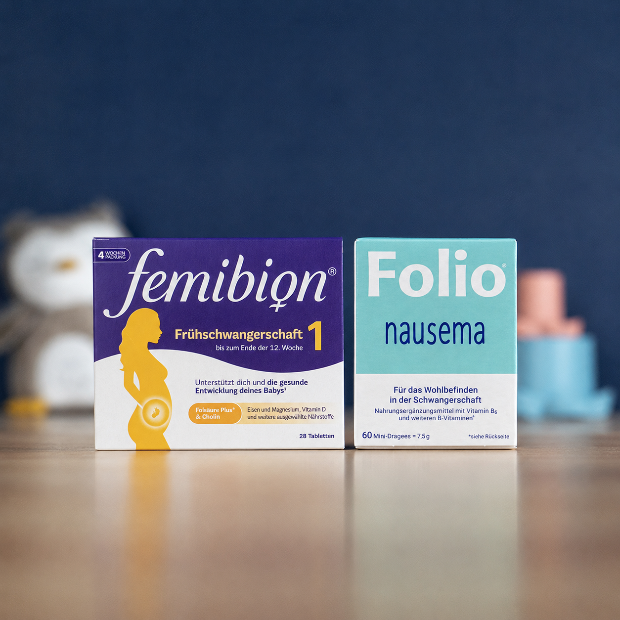 A collection of pregnancy supplements and oils from various German brands arranged on a pharmacy counter.