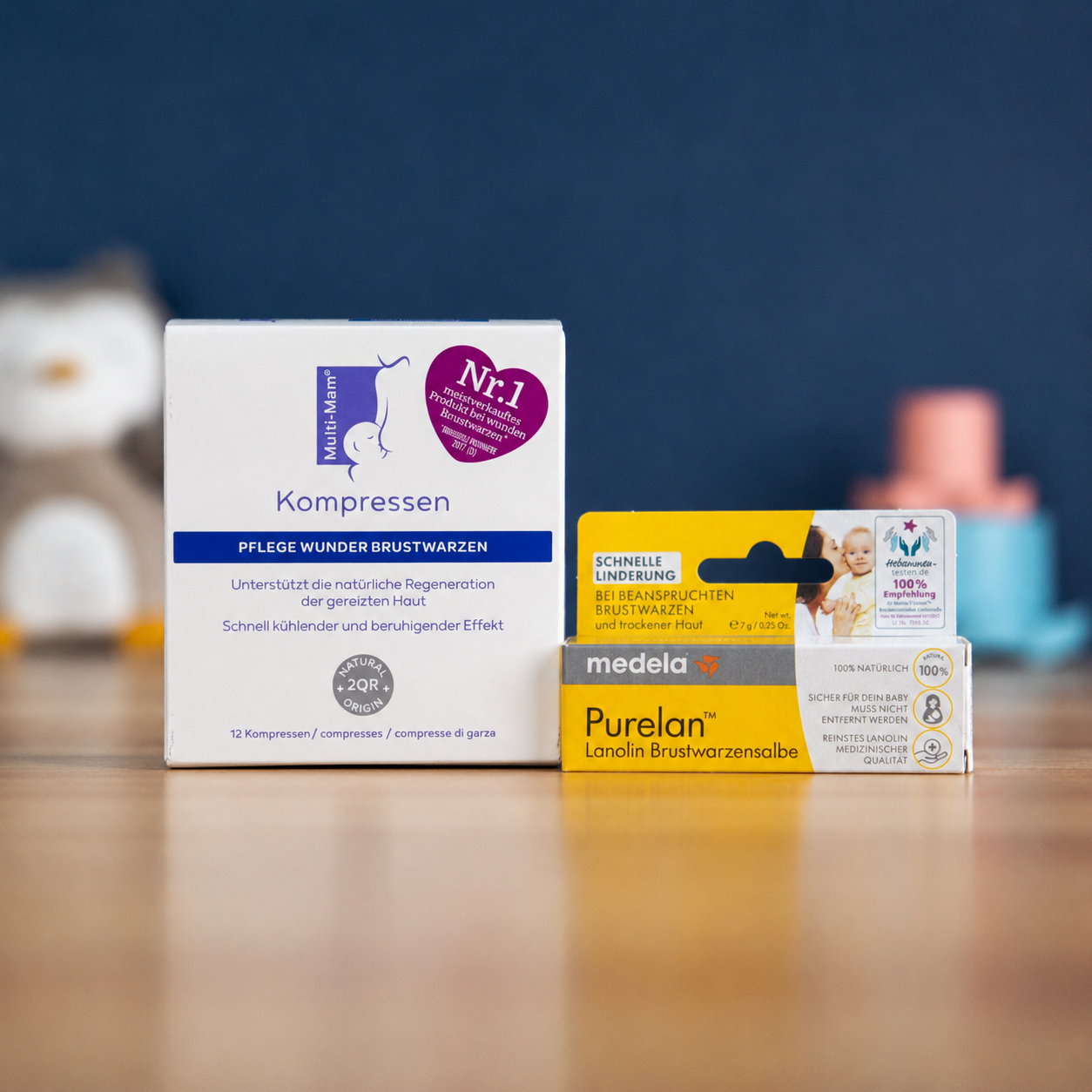Boxes of Femibion and Folio nausema pregnancy supplements stacked on a wooden counter in a pharmacy.
