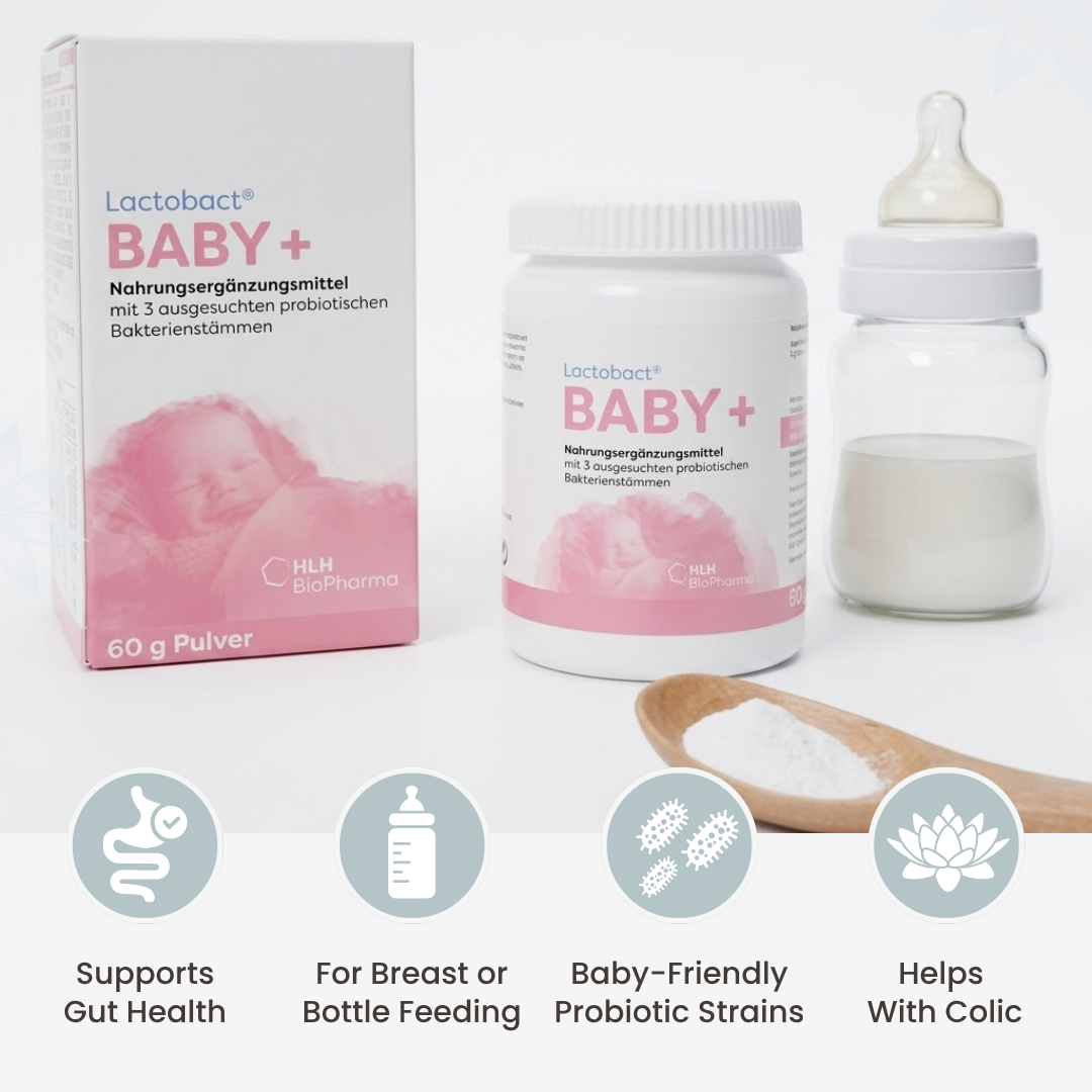 A bottle of children's oil and a box of baby probiotics sit on a glass shelf in a pharmacy.