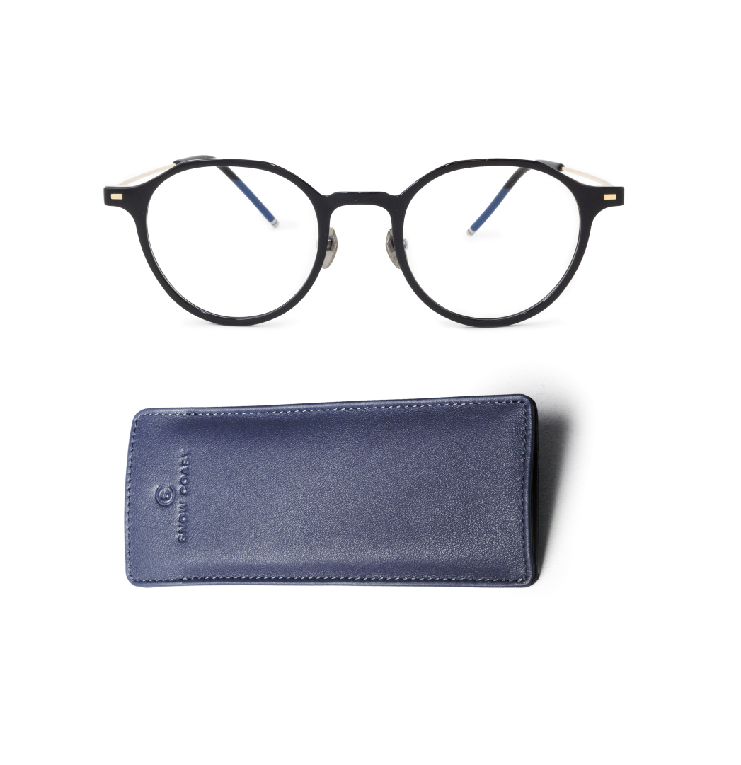 A pair of round, black-framed eyeglasses and a blue leather case on a white background.