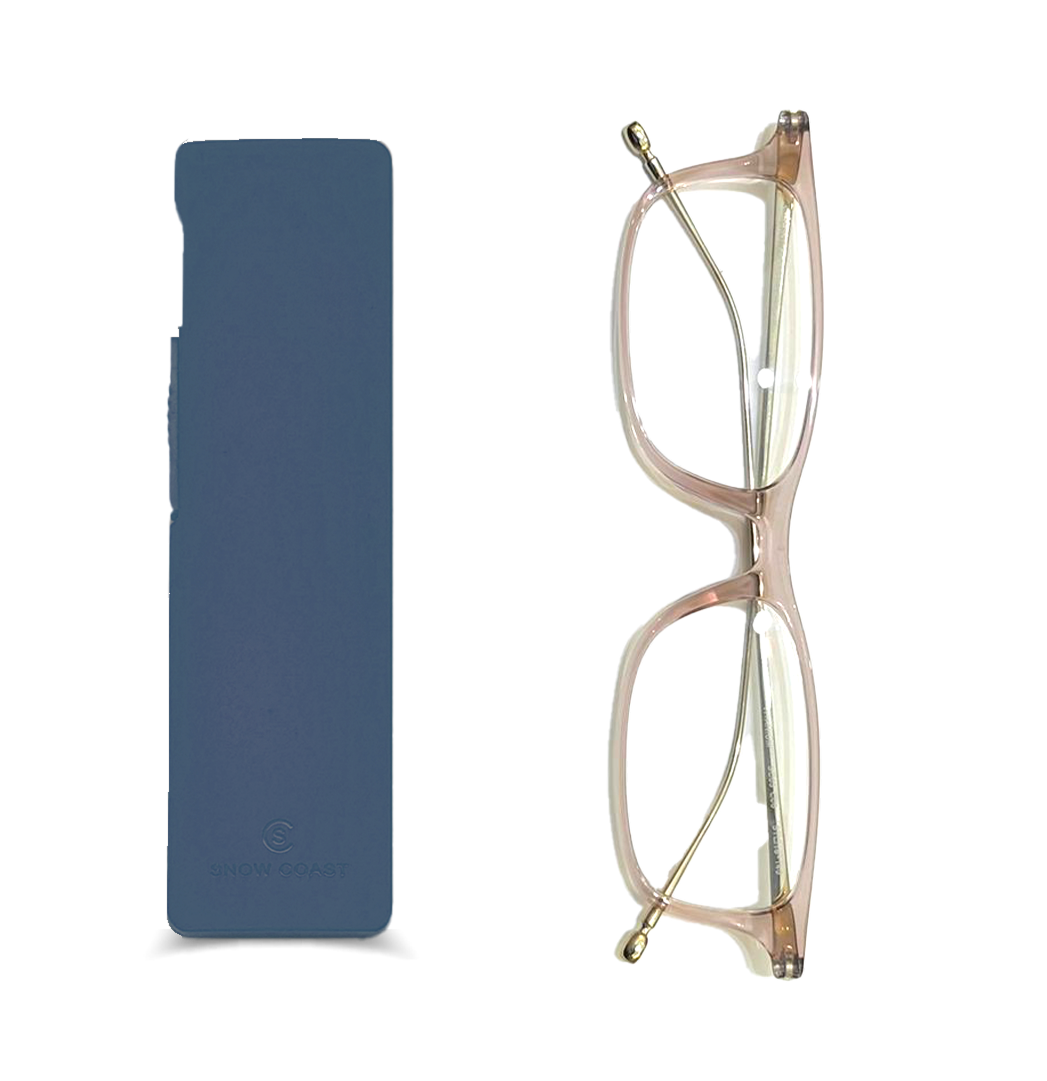 Transparent glasses with thin frame beside a navy eyeglass case.