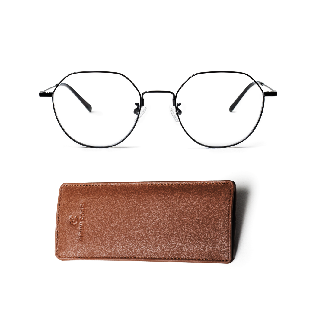 A pair of black, geometric-framed eyeglasses sits above a brown leather case on a white background.