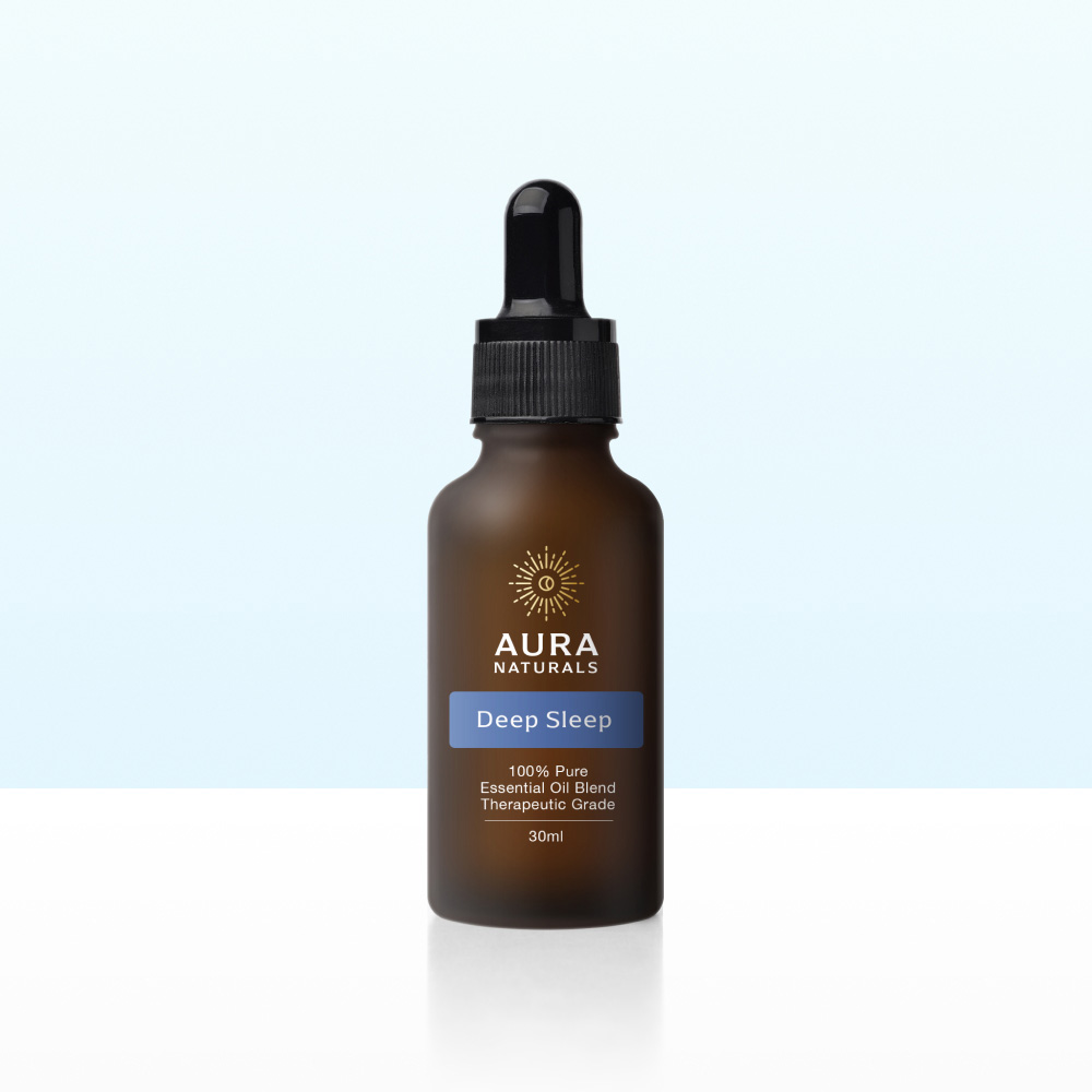 A brown bottle of Aura Naturals Deep Sleep essential oil blend with a black dropper cap.