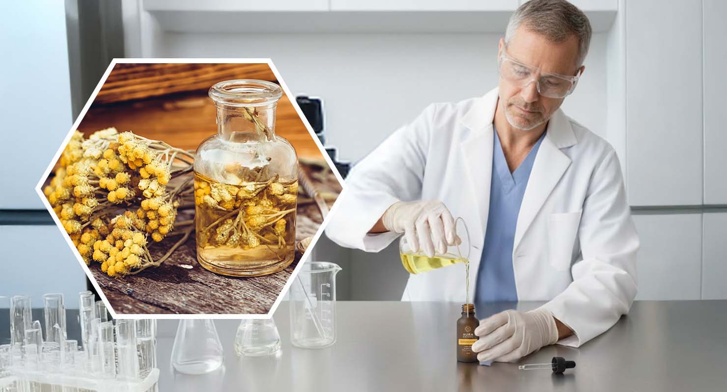 A scientist in a lab pours a yellow liquid, with an inset of dried yellow flowers in oil.