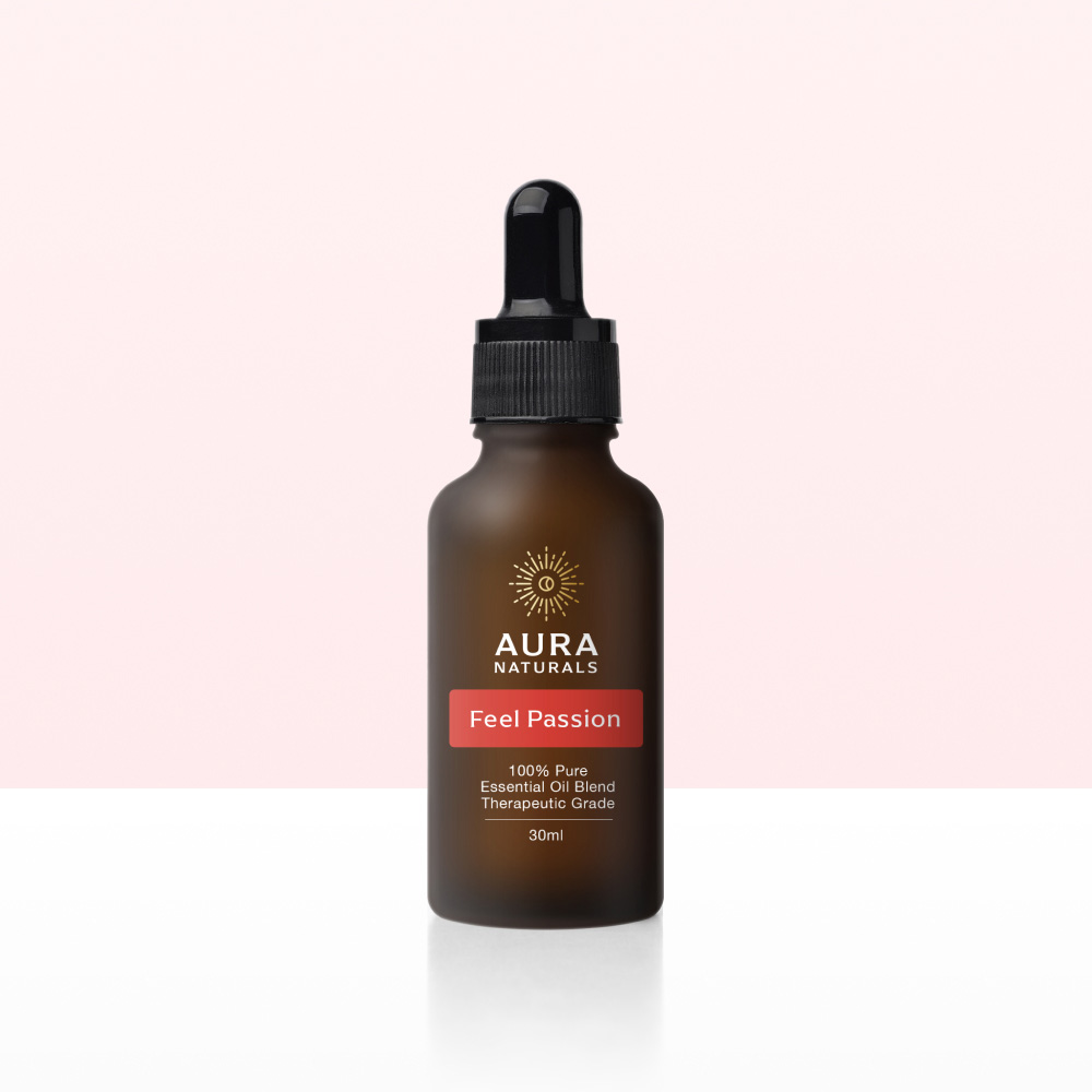 A brown dropper bottle of Aura Naturals 'Feel Passion' essential oil blend on a gradient background.