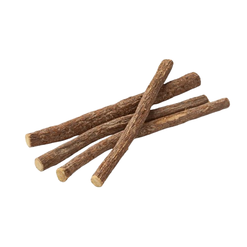 A small pile of dried licorice root sticks on a black background.