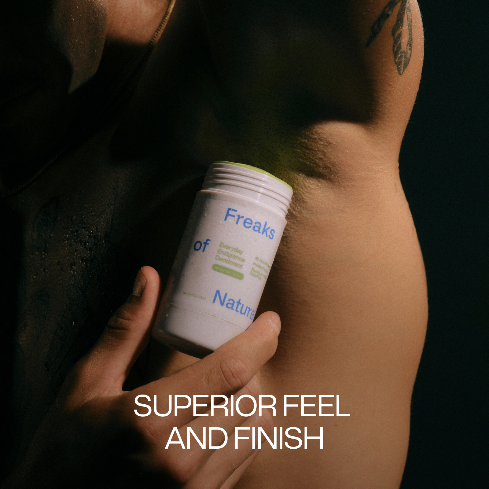 Person applying deodorant to armpit, with text 'SUPERIOR FEEL AND FINISH'.