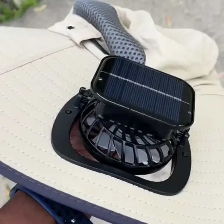 A solar-powered fan attached to a wide-brimmed hat.
