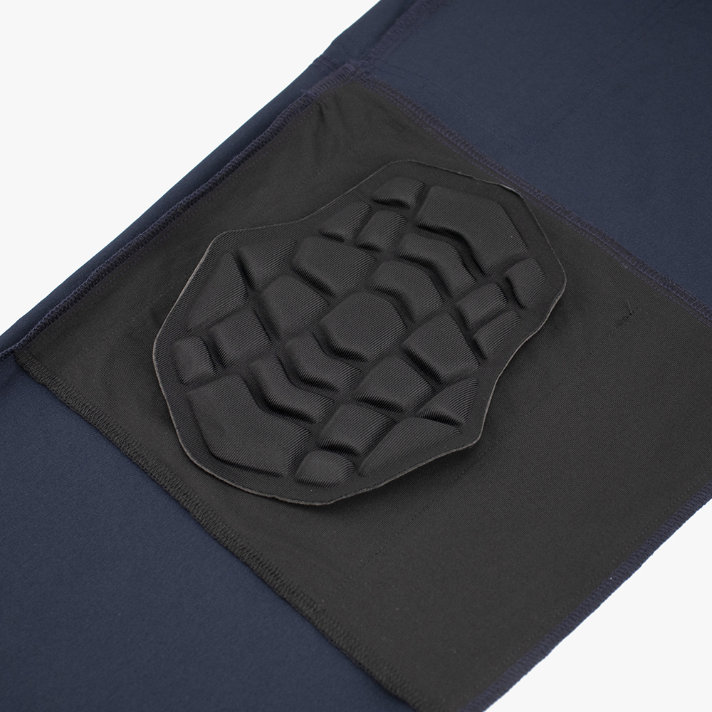 GENU removable knee protection padding on navy scrub fabric