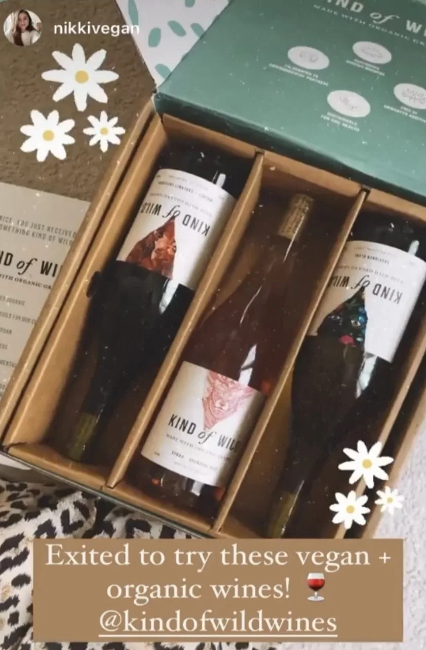 Three bottles of Kind of Wild wine in a cardboard box.