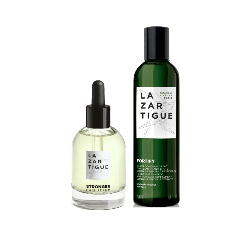 Two LaZartigue hair care products with green and clear bottles.