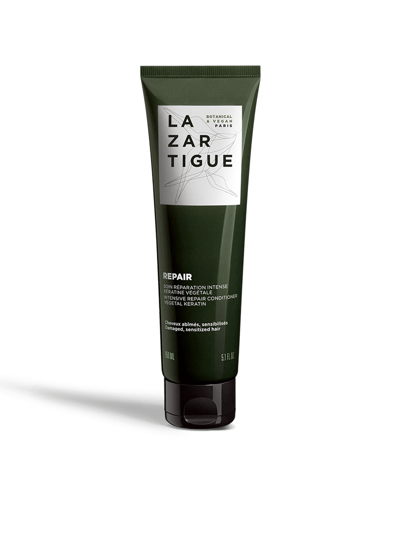 Dark green tube of Lazartigue repair conditioner.