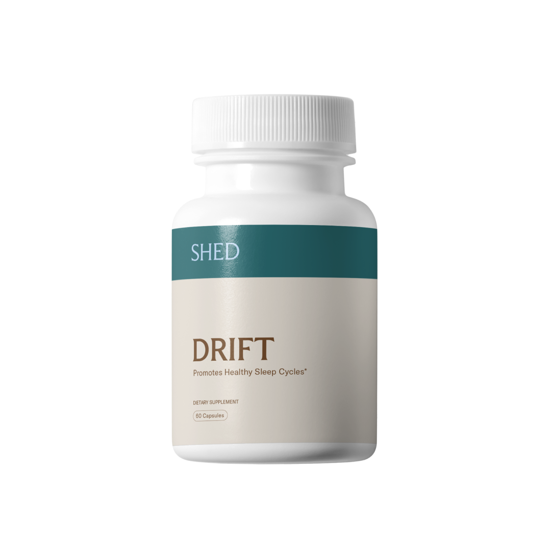 White bottle labeled 'DRIFT' dietary supplement for sleep cycles.